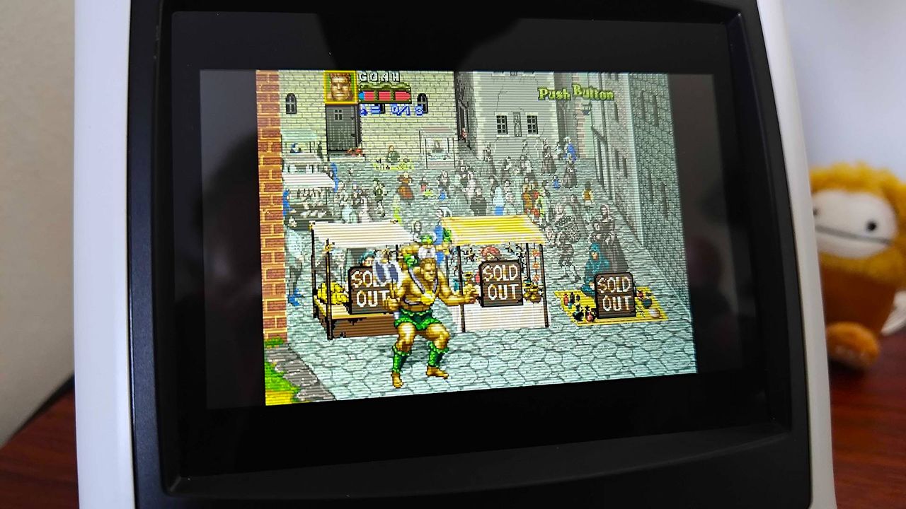 Close up of Sega Astro City Mini screen with Golden Axe: The Revenge of Death Adder gameplay on screen.
