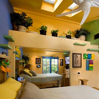 bedroom with yellow wall and and potted plants