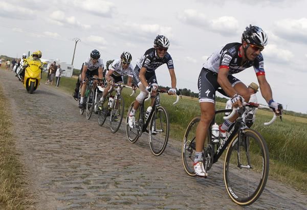 Fabian Cancellara leads Andy Schleck across the pav&eacute;