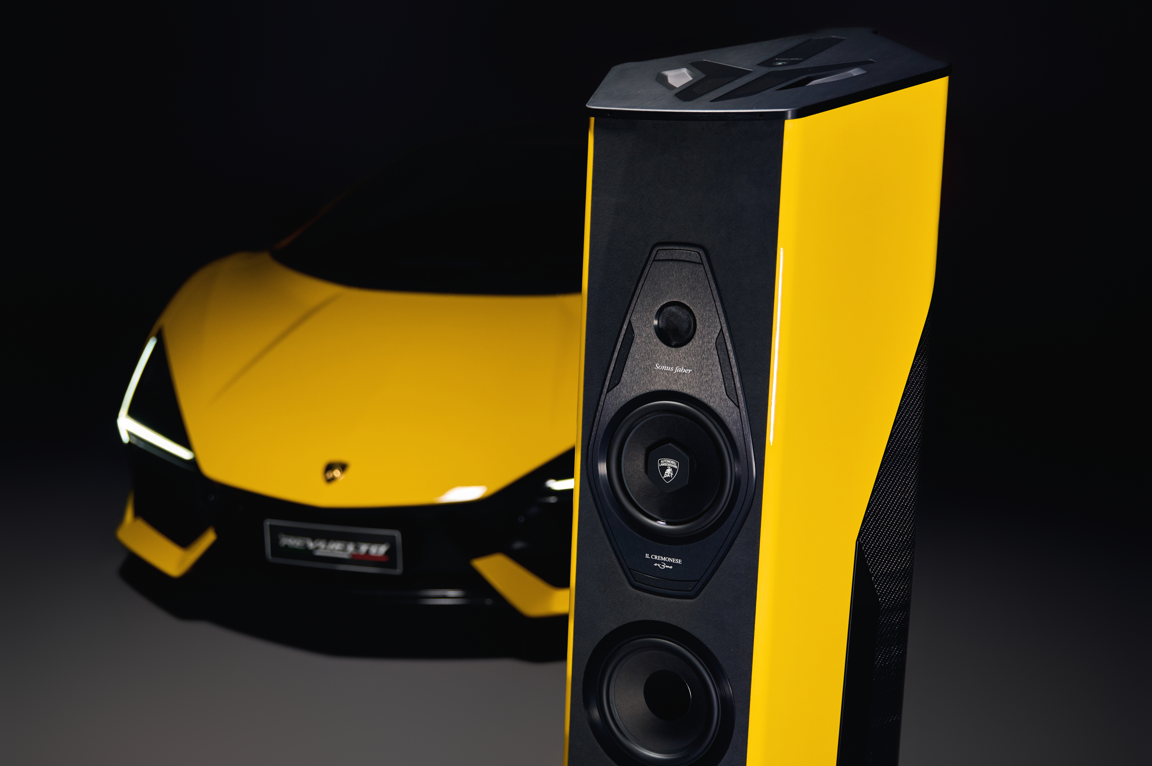 Sonus Faber Il Cremonese Ex3me – Automobili Lamborghini Edition speakers in front of a yellow Lamborghini