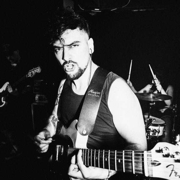 Guitar Player author Matt McCracken playing guitar on stage