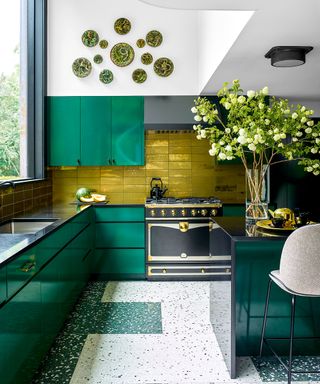 Colorful kitchen with green walls and cabinets