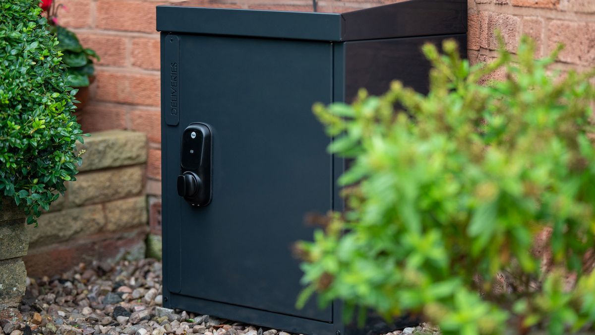 The Yale Smart Delivery Box in front of a home