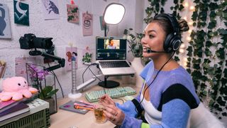 A streaming talking to camera while wearing the ATH-M50xSTS-USB streaming headset