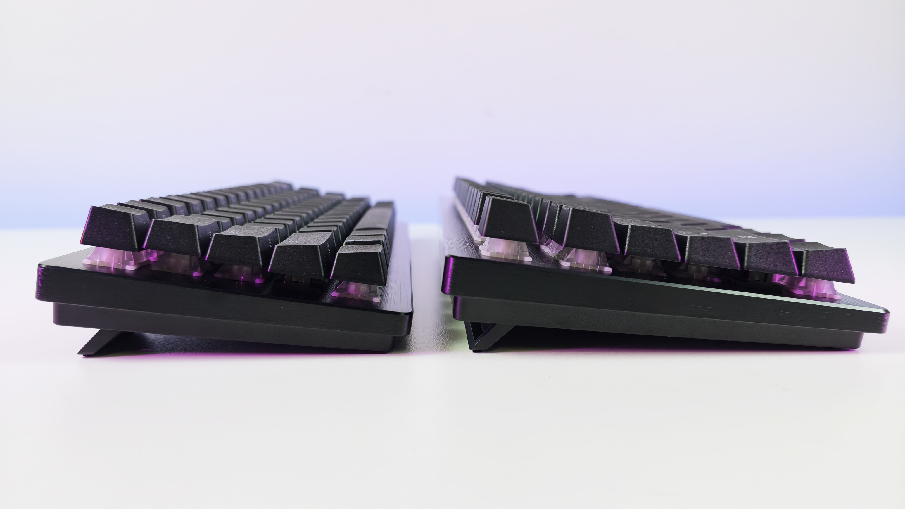Side-profile comparison of the Razer Huntsman V3 HE Mini 65% and TKL keyboards, showing their incline and height on kickstands.