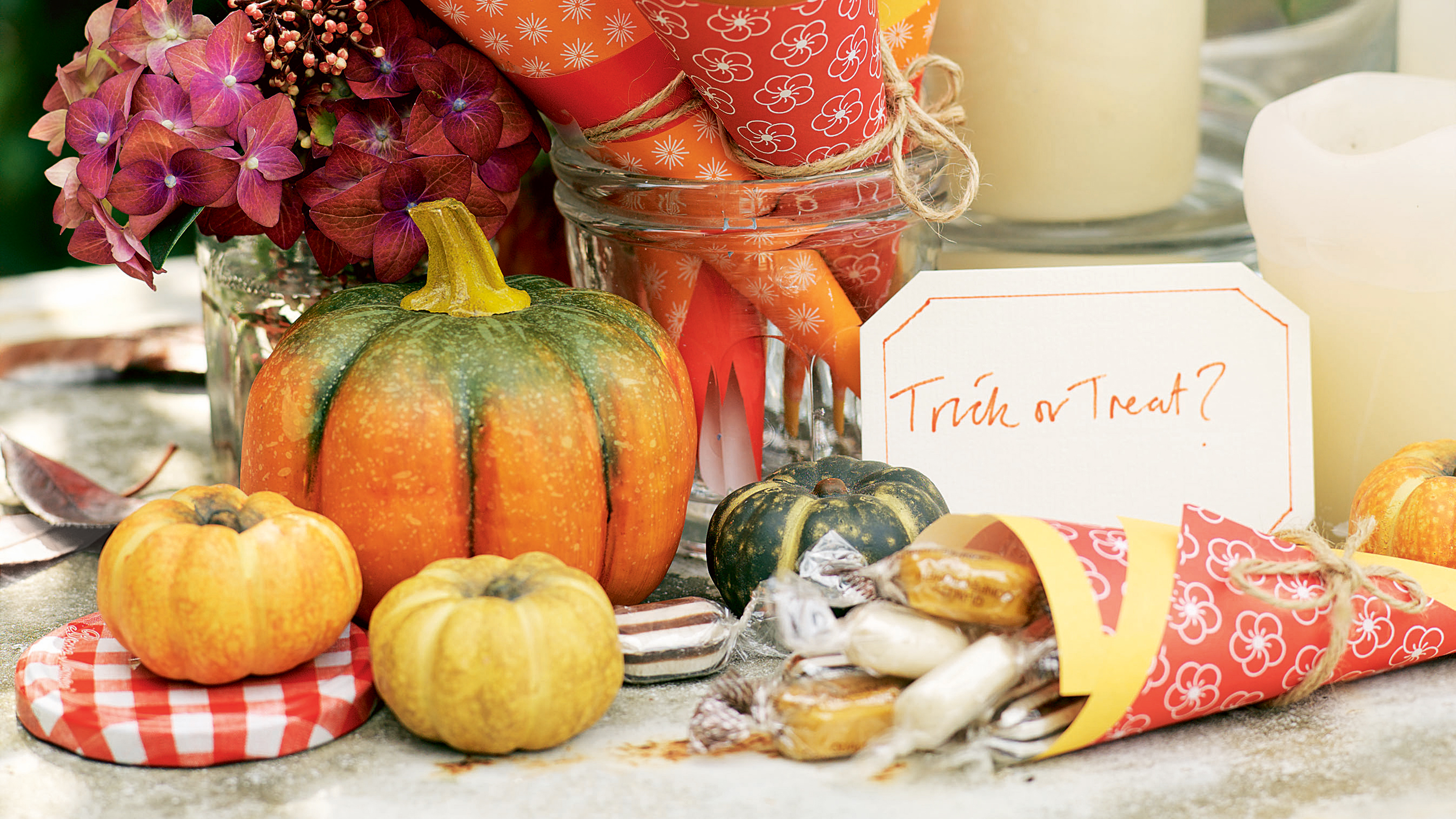 Halloween tablescape with pumpkins and sweets