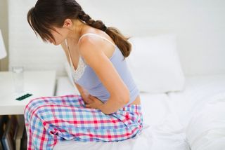 woman with stomach cramps