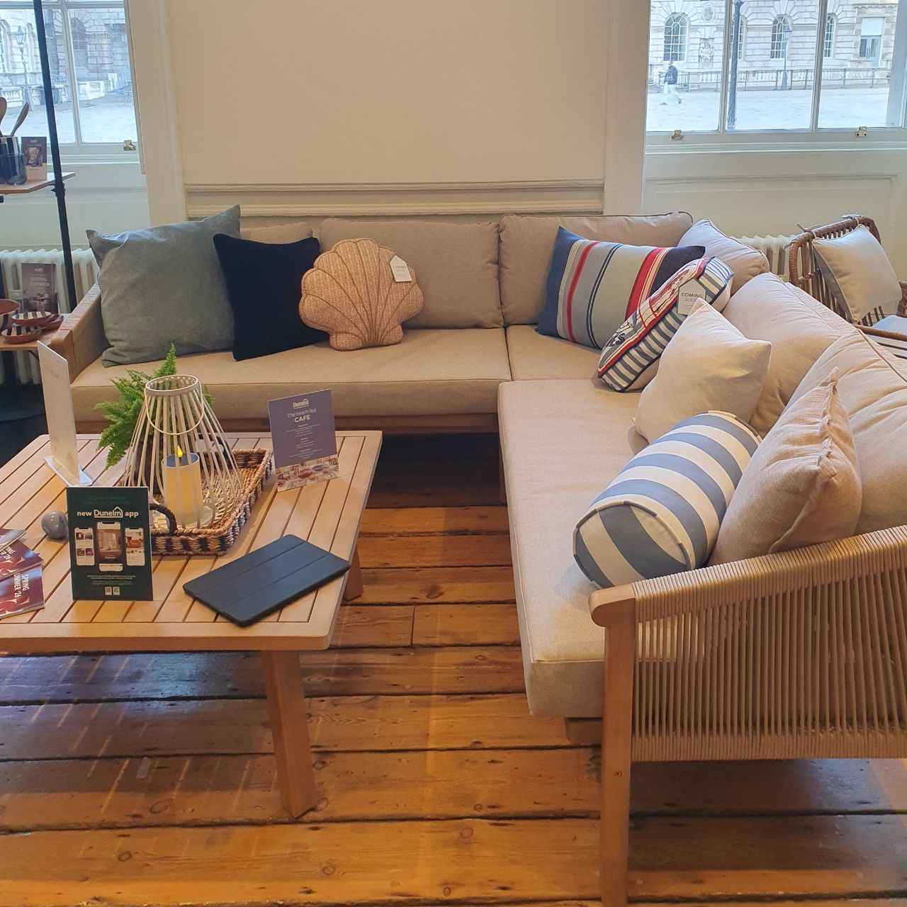 A corner outdoor sofa with coastal-themed outdoor cushions at the Dunelm spring/summer 2026 press preview