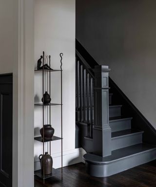 Hallway with stairs painted in dark gray