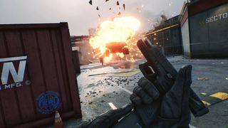 A screenshot from Delta Force, showing someone holding up a gun while facing an explosion.