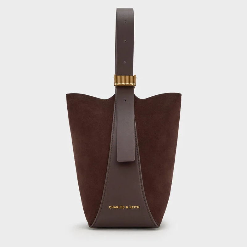 A brown suede bucket bag