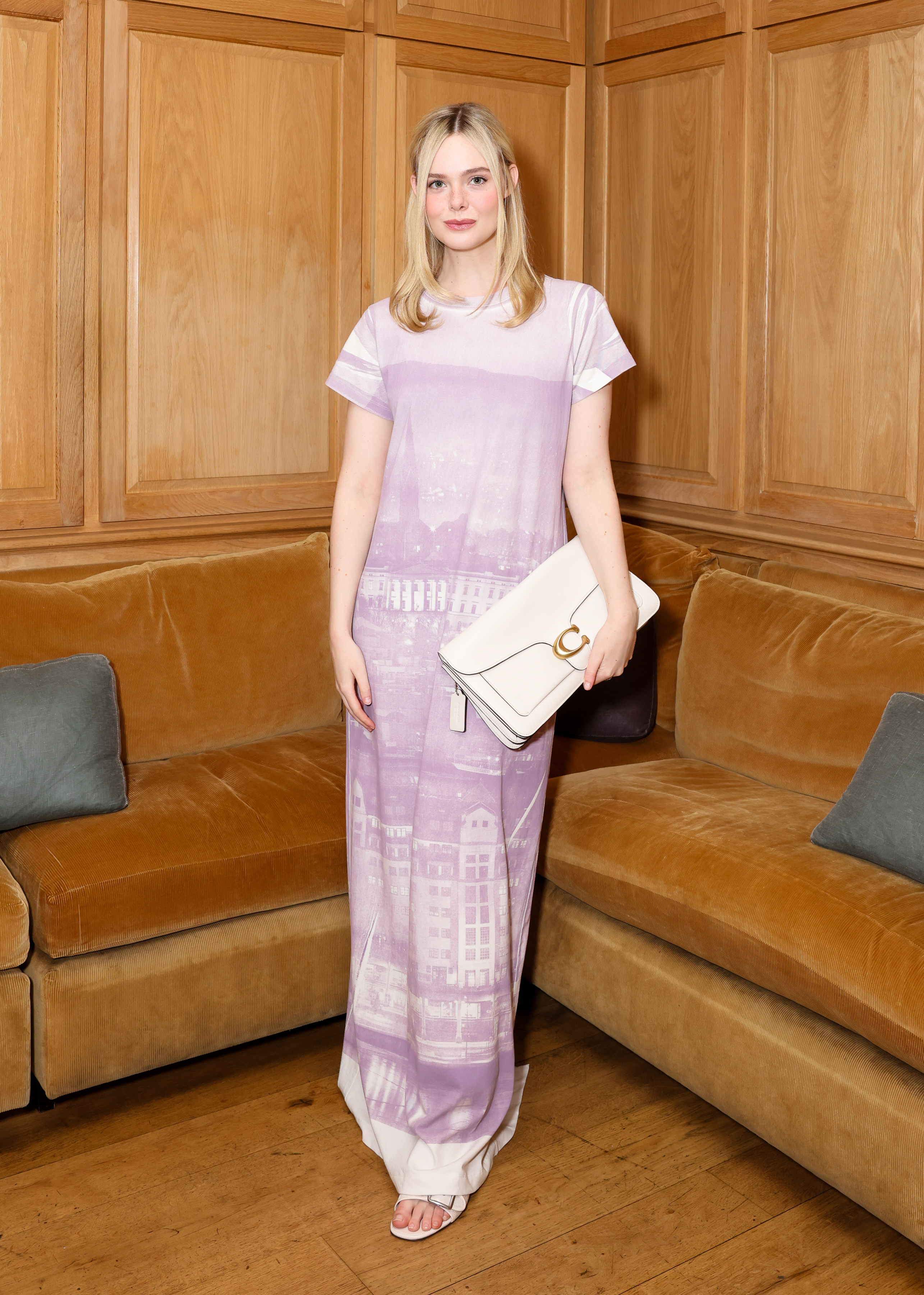 Elle Fanning wears a light purple maxi dress at a Coach dinner in Los Angeles