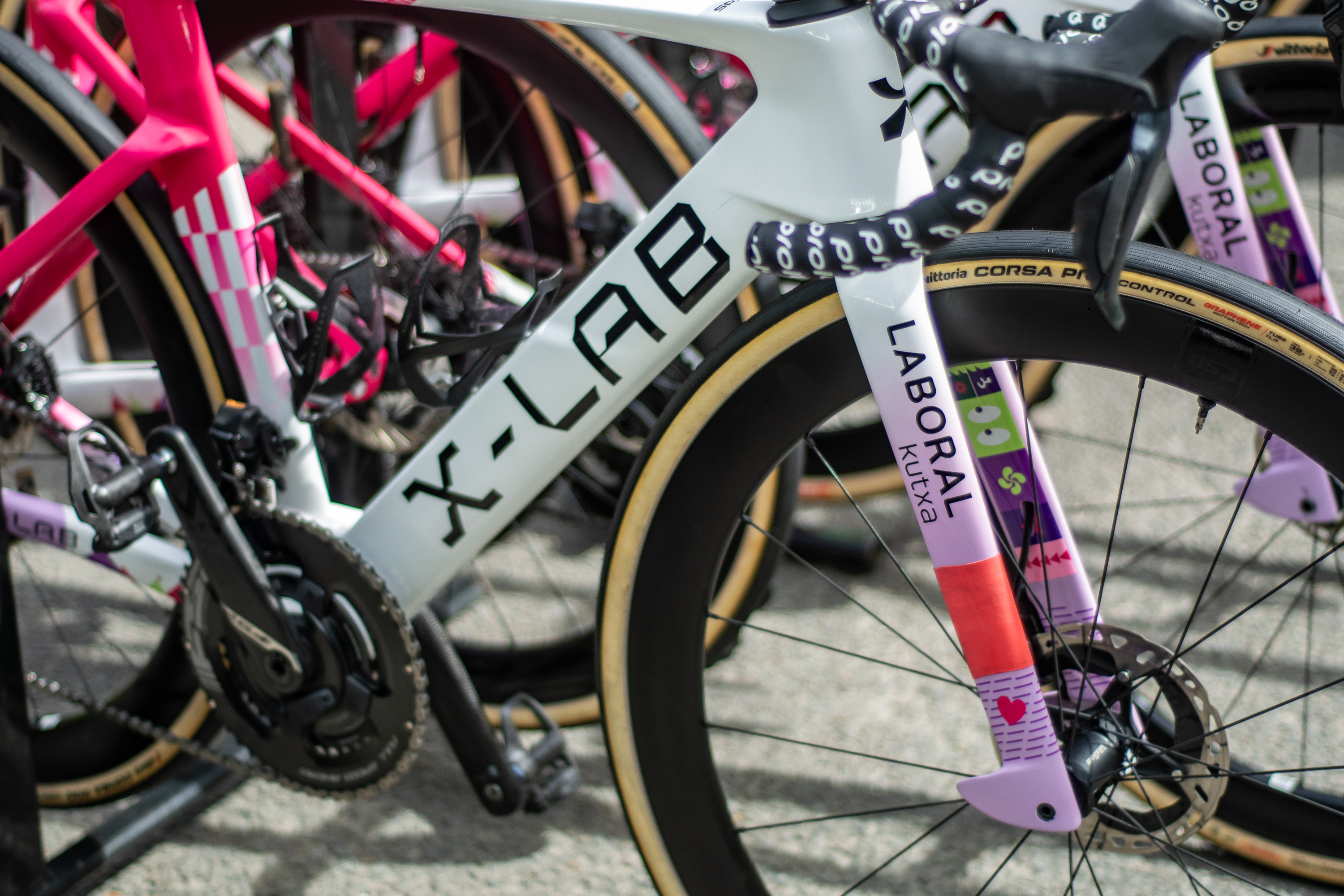 A pink and white Laboral Kutxa - Fundaci&amp;oacute;n Euskadi team X-Lab bike