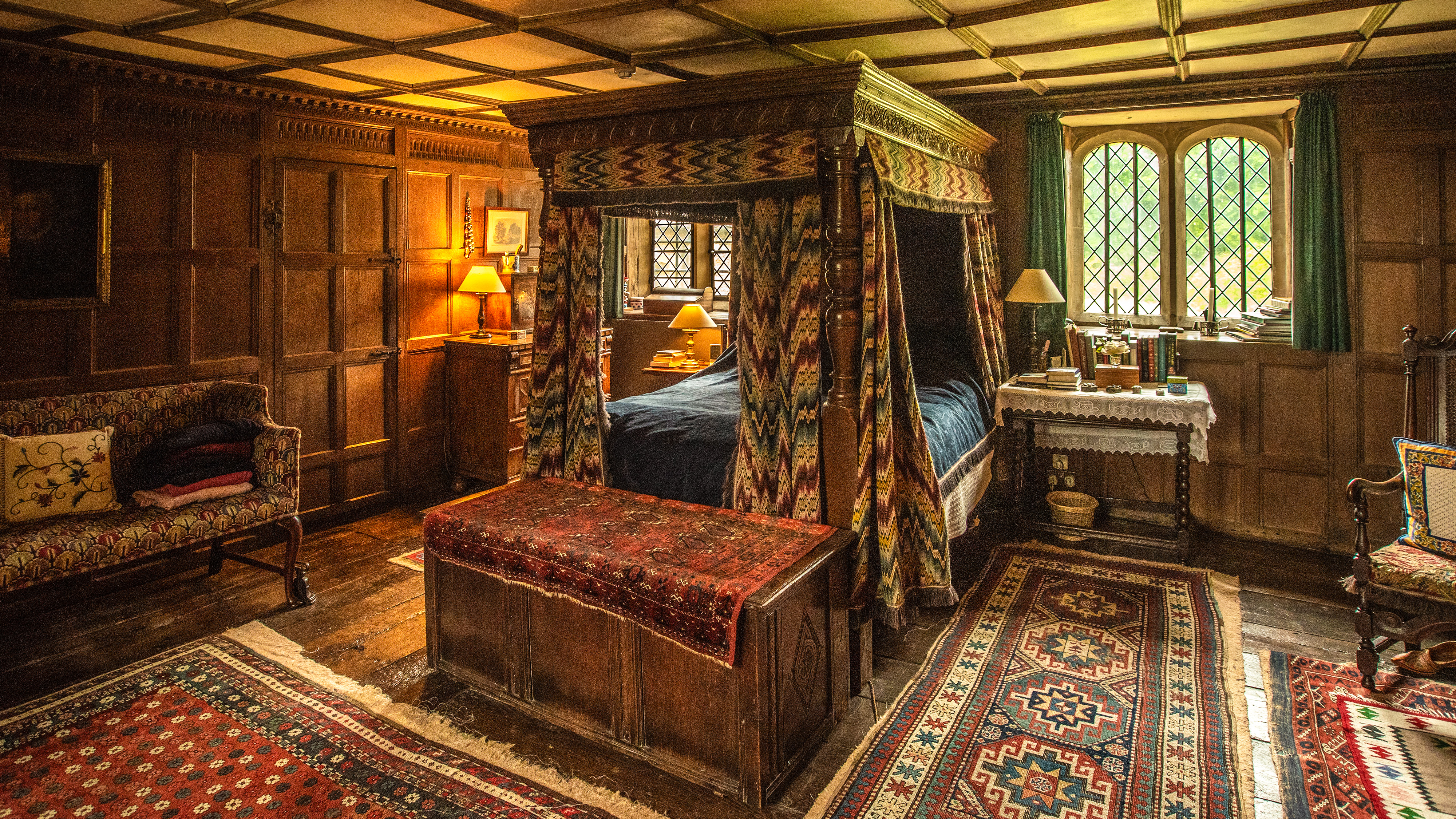 Interior of stately home showing a four-poster bed in Bowood House
