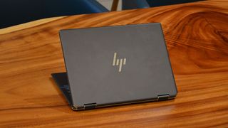 An HP Spectre x360 2022 on a wooden table