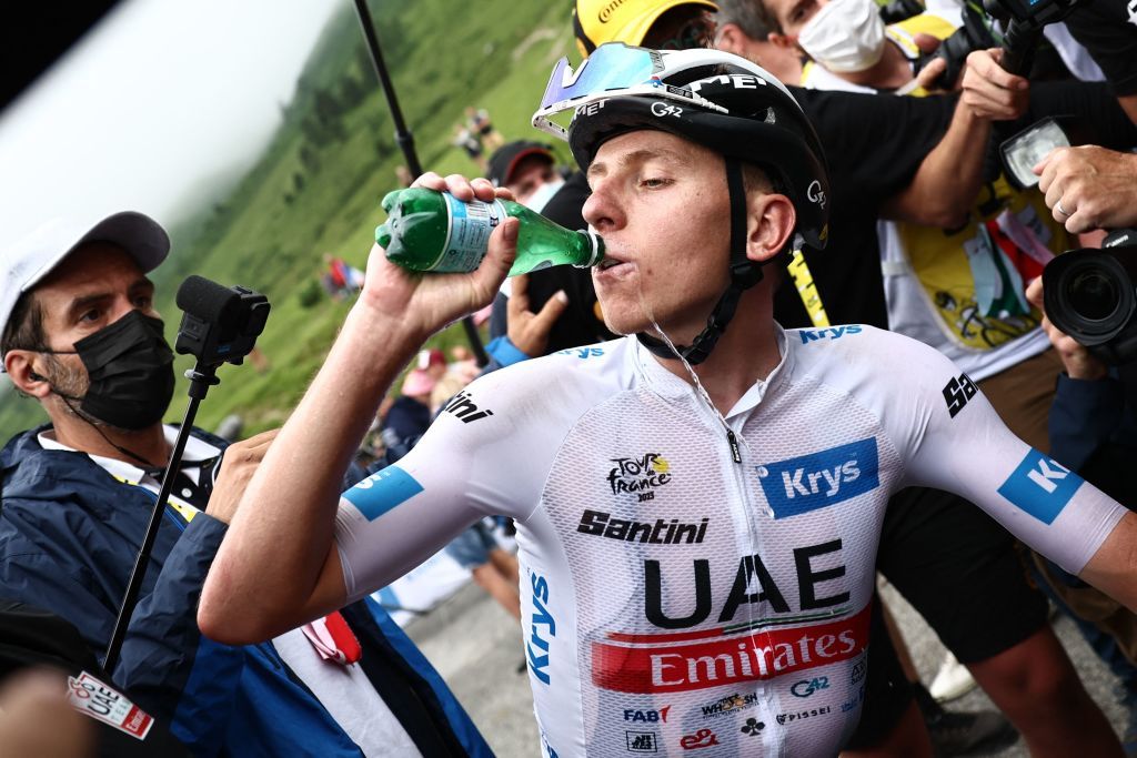 UAE Team Emirates Slovenian rider Tadej Pogacar wearing the best young riders white jersey drinks water as he celebrates winning the 6th stage of the 110th edition of the Tour de France cycling race 145 km between Tarbes and CauteretsCambasque in the Pyrenees mountains in southwestern France on July 6 2023 Photo by AnneChristine POUJOULAT POOL AFP Photo by ANNECHRISTINE POUJOULATPOOLAFP via Getty Images