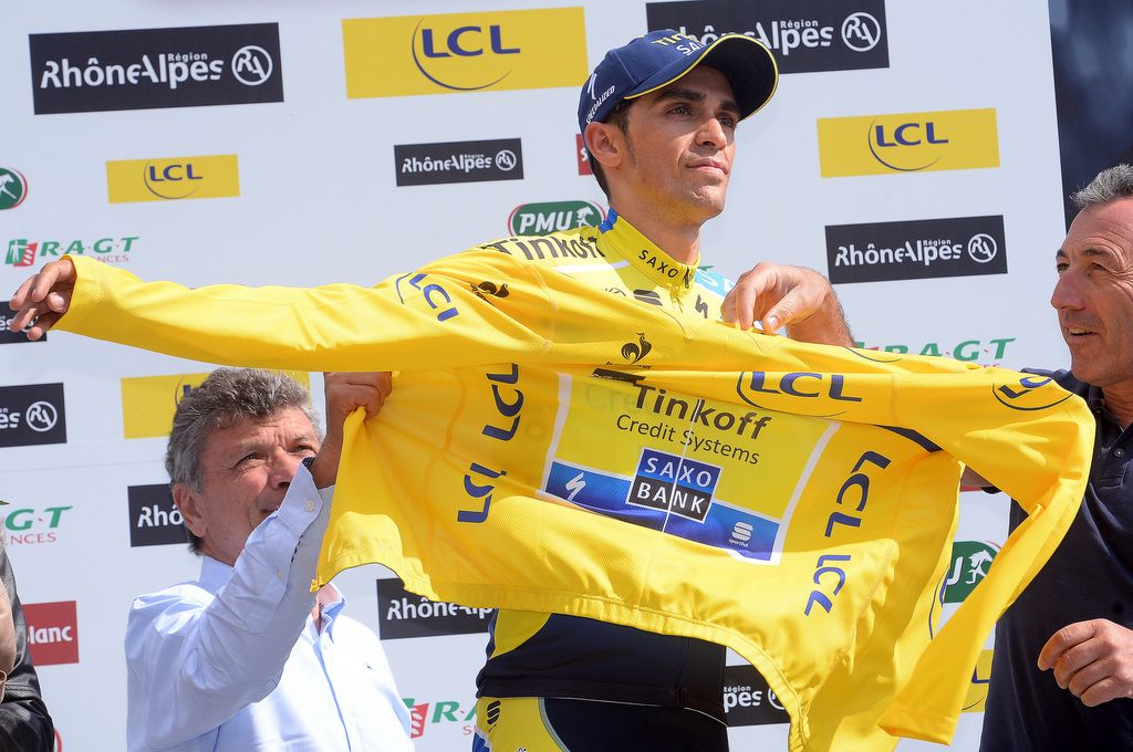Alberto Contador pulls on the yellow jersey during the 2014 Criterium du Dauphine