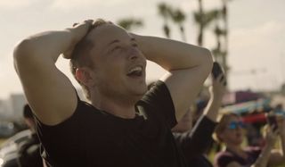 Elon Musk watches the first flight of SpaceX's Falcon Heavy rocket on Feb. 6.