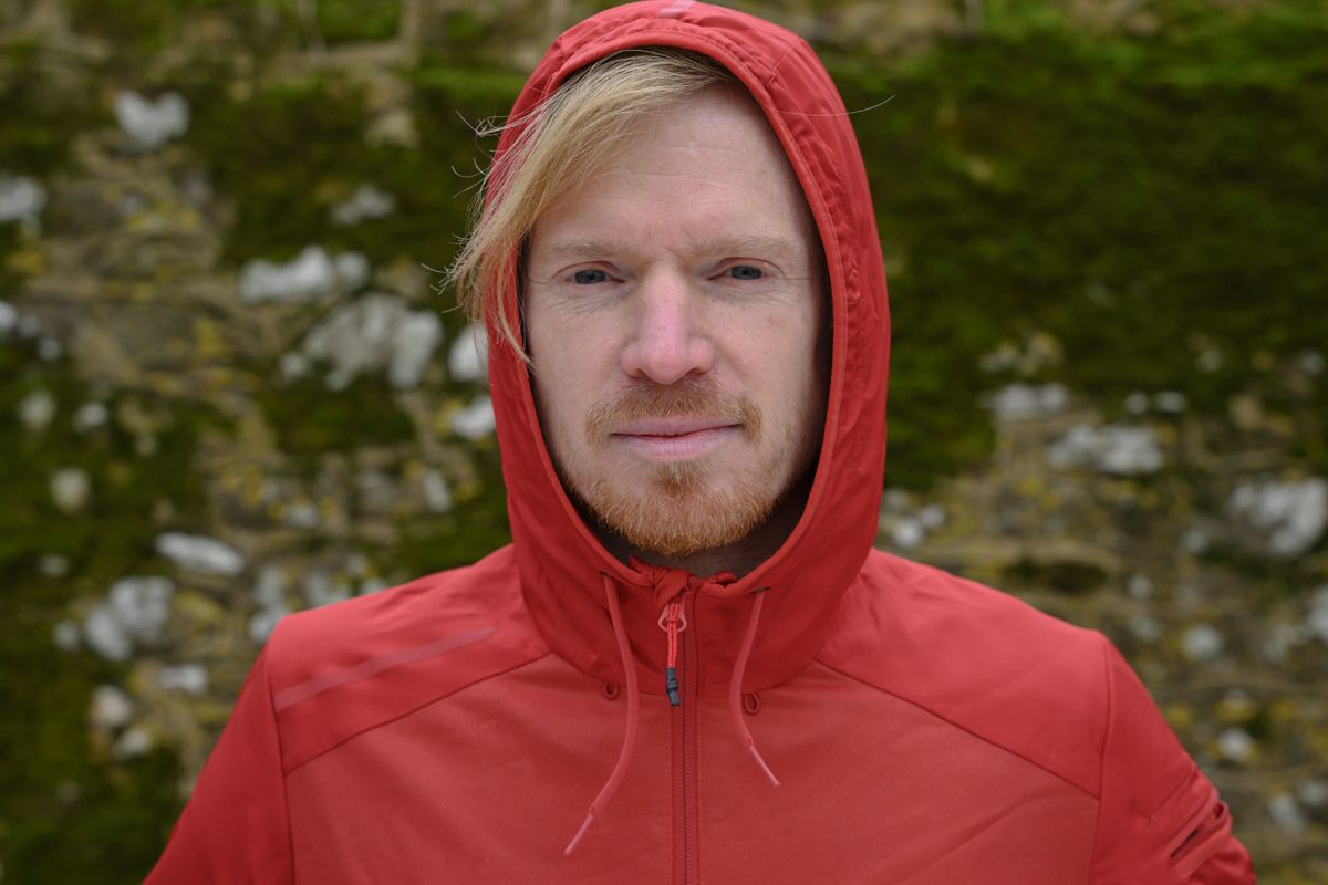A man in a red hoodie
