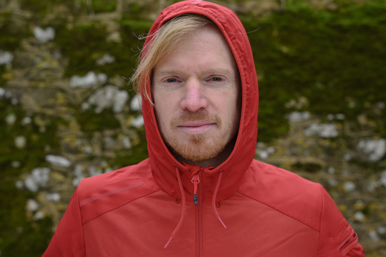 A man in a red hoodie