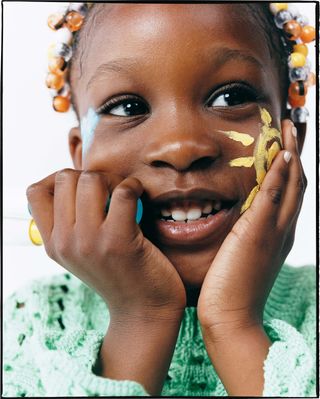 Zara kids beauty line being worn by young girl with sun drawn on her cheek