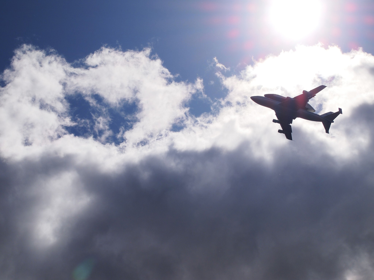 Enterprise and SCA Fly Against Sun and Clouds
