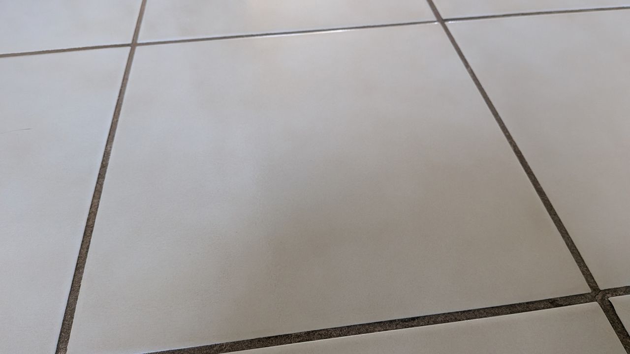No ketchup remaining on tiled floor after the mopping test