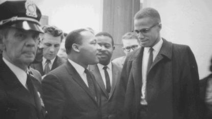 Black and white photograph of Martin Luther King Jr and Malcolm X 
