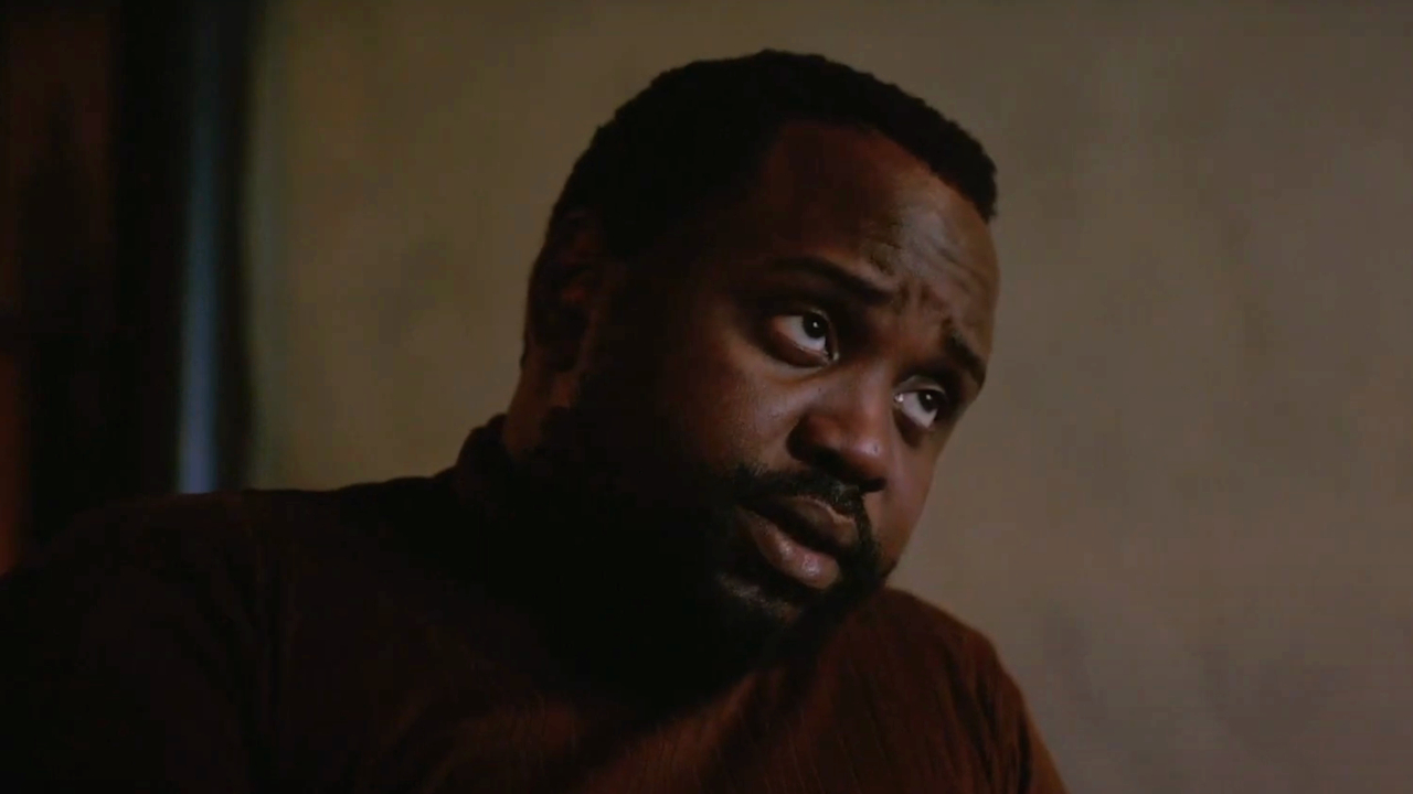 Brian Tyree Henry cocks his head with a weary look in If Beale Street Could Talk.