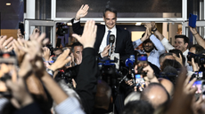 Greek Prime Minister Kyriakos Mitsotakis waves at crowds of supporters after elections in Greece on 21 May