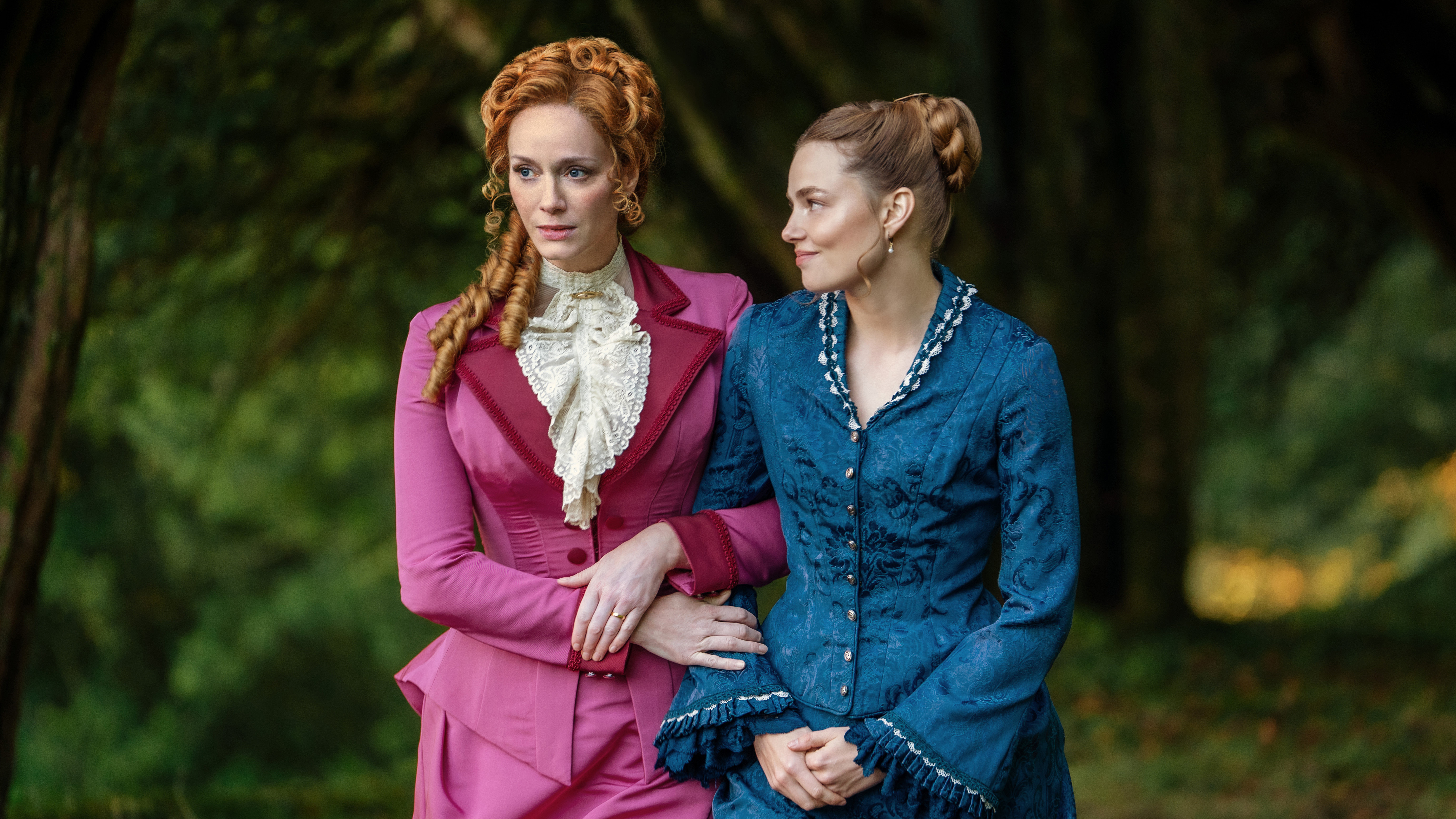 Christina Hendricks as Patti St. George and Kristine Frøseth as Nan St. George in The Buccaneers season 2.