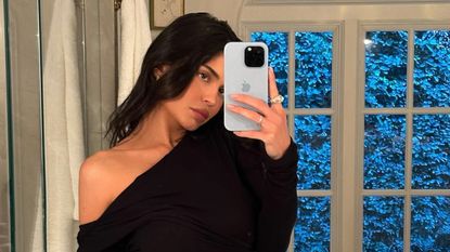 Kylie Jenner mirror selfie in black one shoulder cropped top
