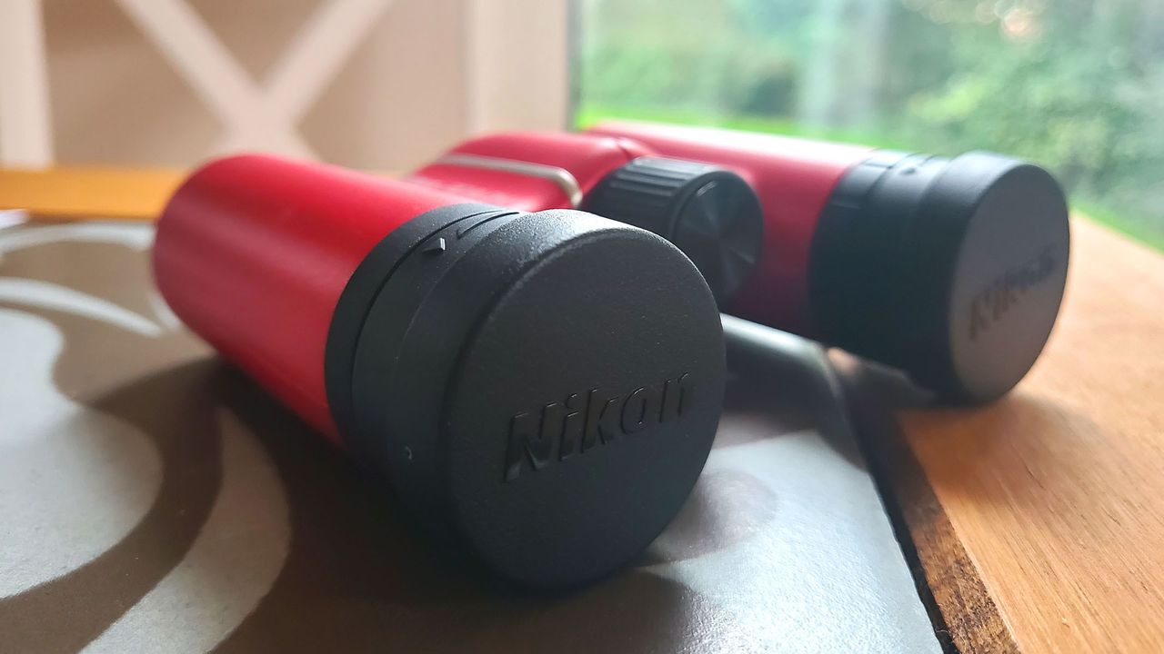 Nikon Aculon T02 8x21 lens caps covering objective lenses
