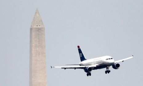 A US Airways plane makes its final approach into Reagan airport in Washington, D.C.