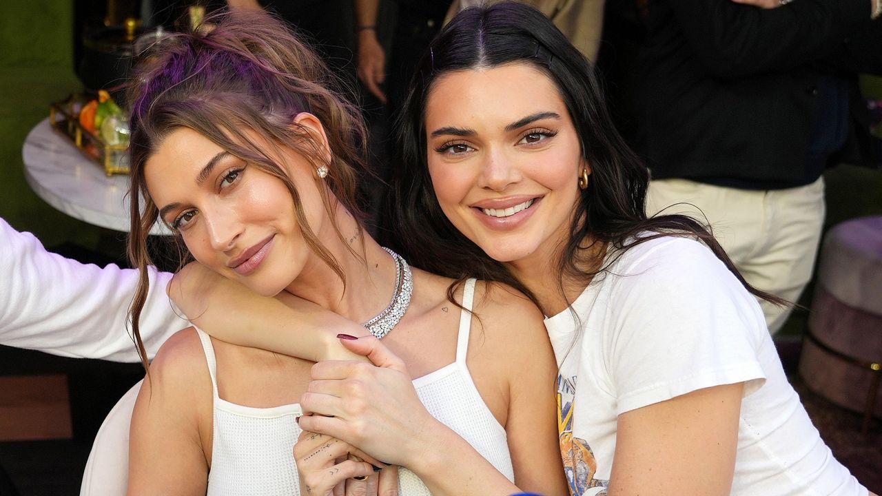 Kendall Jenner throws an arm around friend Hailey Bieber