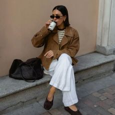 An image of @_jessicaskye wearing a designer tote bag. 