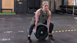 Amy Scott demonstrates weight plate ground to overhead
