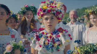 Dani looks shocked as she stands next to some other women in A24 folk horror movie Midsommar, one of February 2024's new Max movies