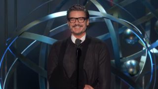 Pedro Pascal in arm brace presenting at 2023 Emmys