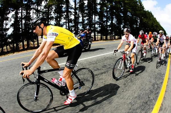 Yellow jersey Kristian House with stage winner Darren Lill on his wheel