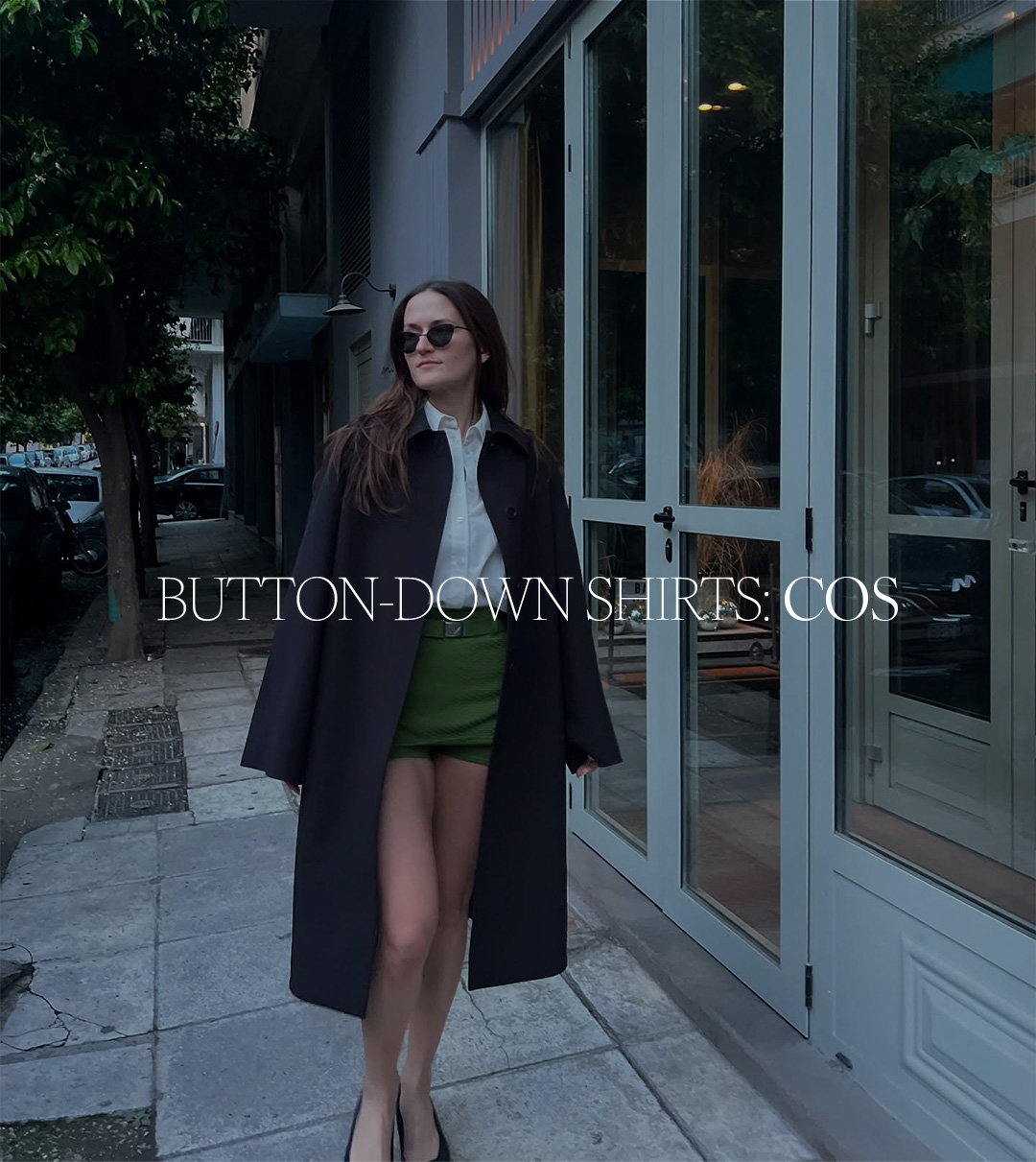 Eliza Huber wearing a COS button-down shirt with a brown coat and green shorts. Text reads: "Button-Down Shirts: COS."