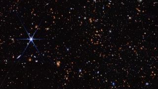 A deep field image from JWST showing stars and galaxies