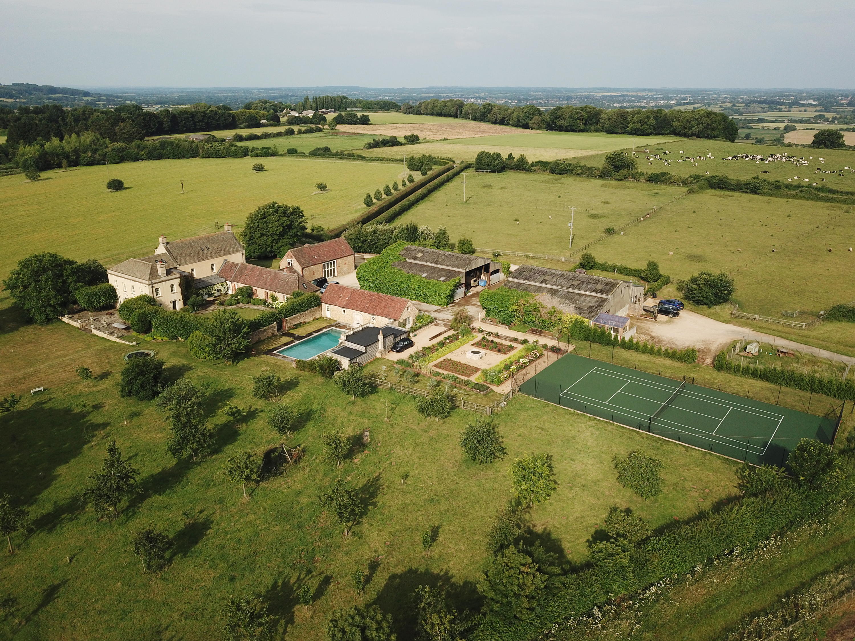 Mount Farm from above, featuring its tennis court and pool