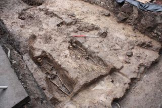 skeletons unearthed in an Edinburgh parking lot