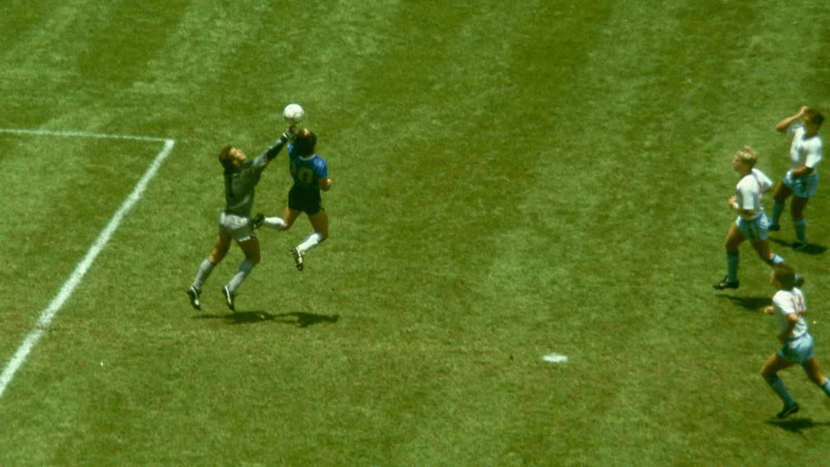 Diego Maradona scores his infamous 'Hand of God' goal for Argentina against England in the quarter-finals of the 1986 World Cup