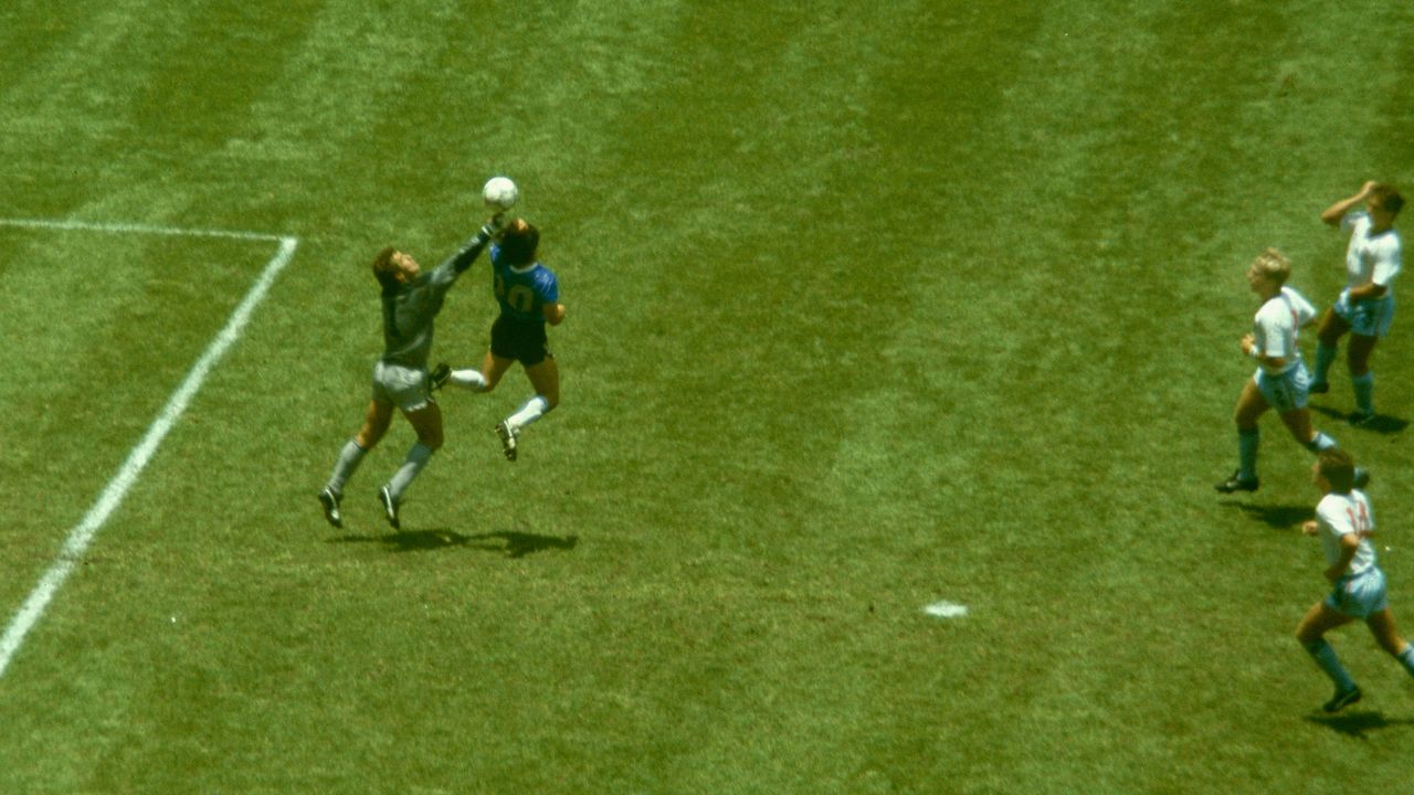 Diego Maradona scores his infamous 'Hand of God' goal for Argentina against England in the quarter-finals of the 1986 World Cup