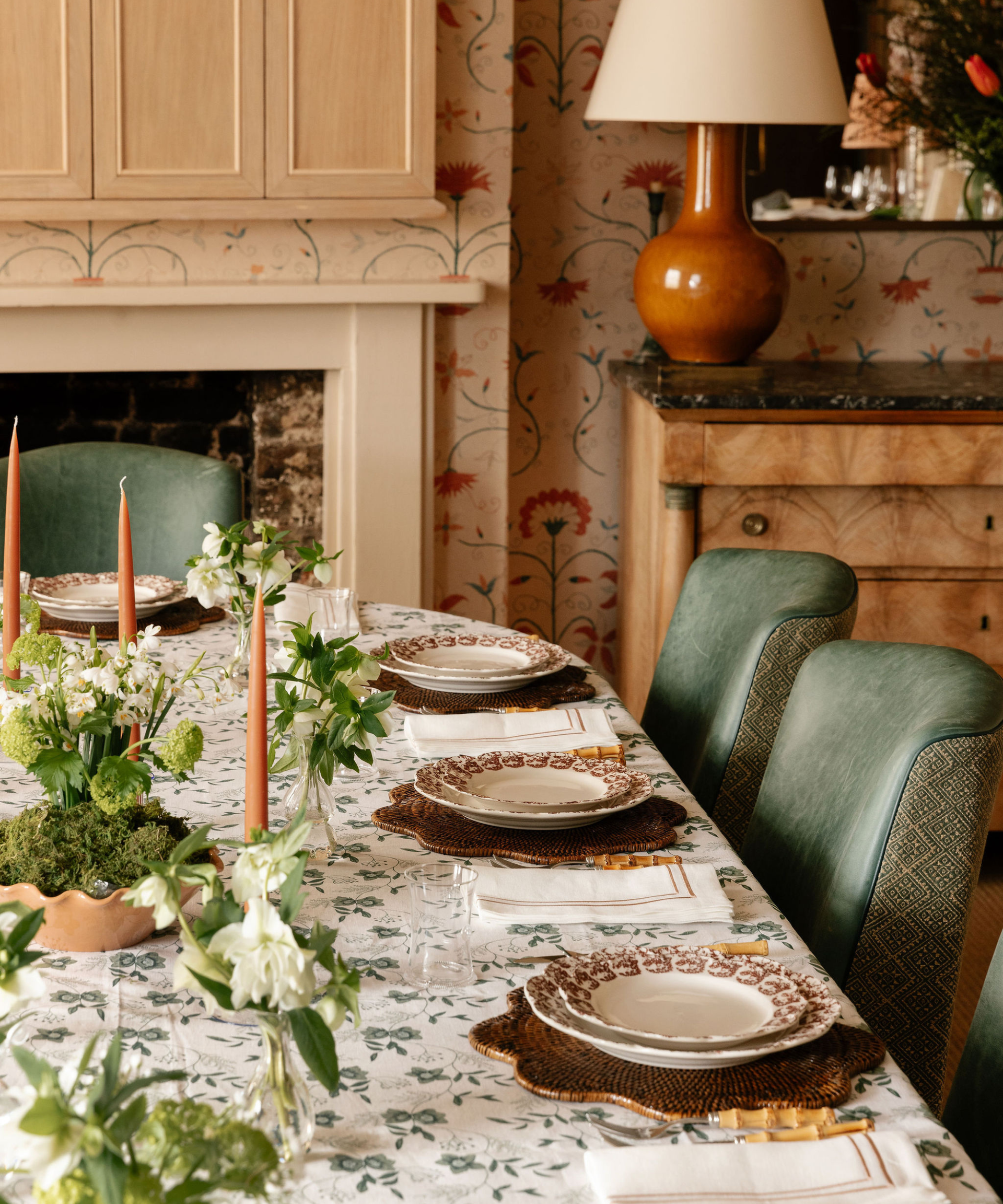 traditional spring table with flowers in bud vases