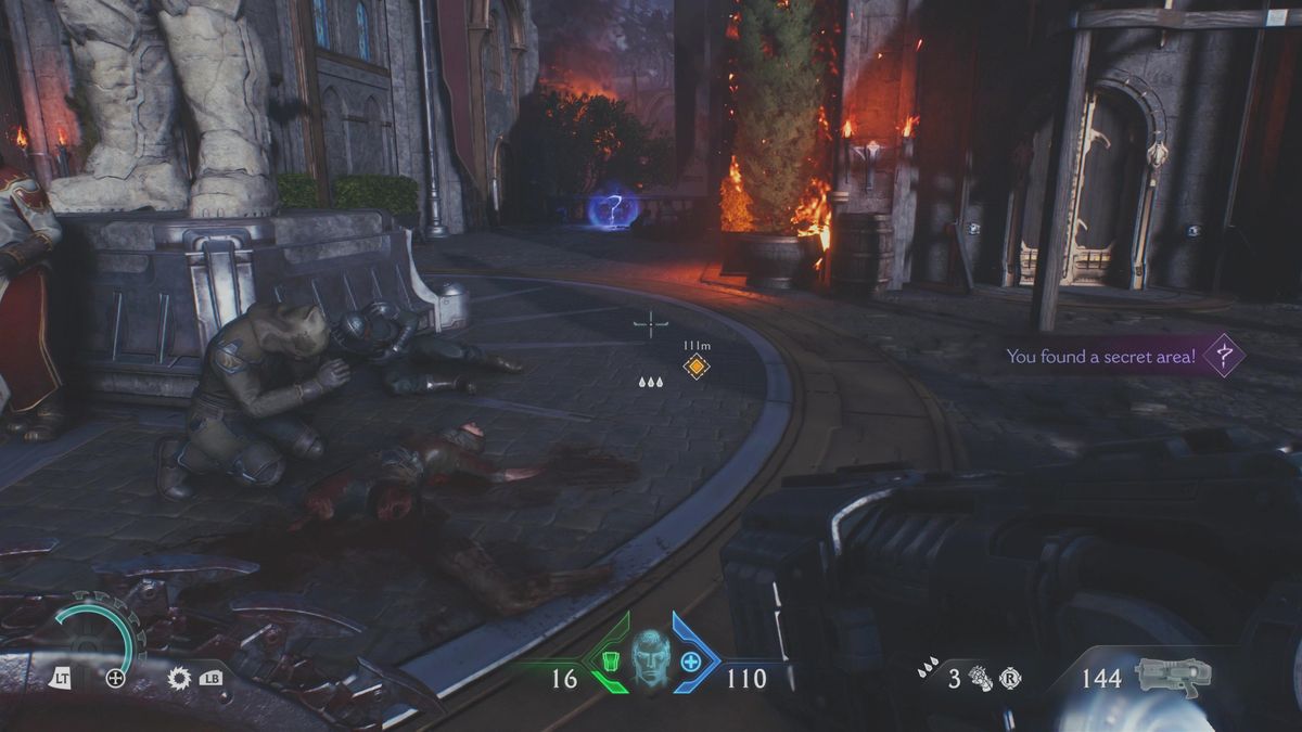 Doom: The Dark Ages Sentinel Barracks secrets - A question mark collectible icon on a ledge, between two burning buildings.