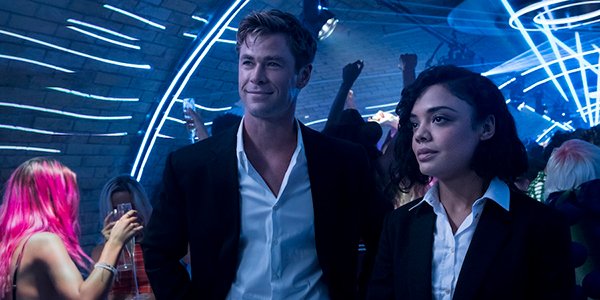 Chris Hemsworth and Tessa Thompson in a club in Men in Black: International