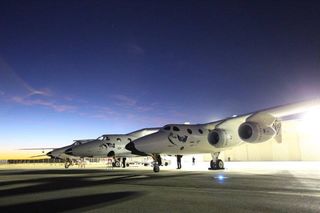 Virgin Galactic's second SpaceShipTwo spacecraft, the VSS Unity, and its WhiteKnightTwo carrier aircraft roll out to a runway at the Mojave Air and Space Port in California on Saturday, Dec. 3, 2016 for Unity's first-ever solo glide test flight.